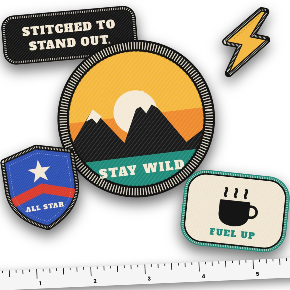 Custom embroidered patches in assorted shapes and colors beside a measuring tape