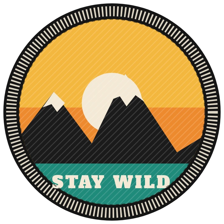 Round custom embroidered patch with a mountain and sunset design and a satin border